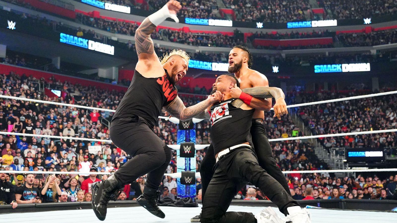 Jimmy Uso (center) being attacked by Solo Sikoa (left) and Tama Tonga (right) on the April 12 episode of SmackDown.