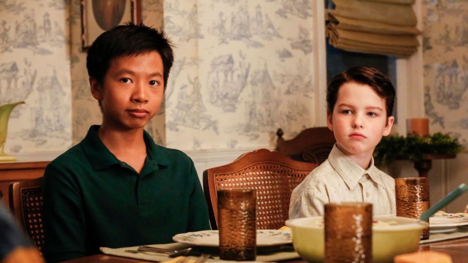 Tam and Sheldon at the dinner table in Young Sheldon