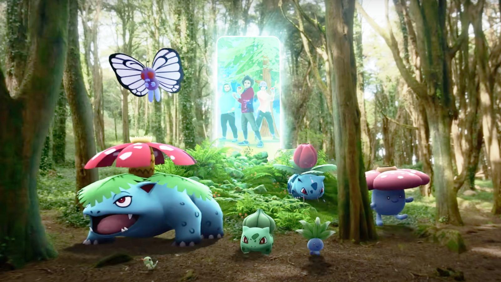 A screenshot from Pokemon Go trailer shows Venusaur, Butterfree, and others in the woods, while several Pokemon Go avatars appear to step through a door-shaped portal