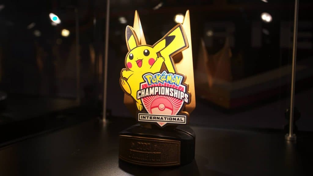 A trophy from Pokemon EUIC is visible in a glass case