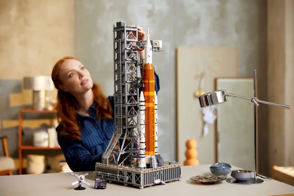 An adult with their LEGO Icons NASA Artemis set