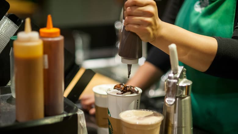 Starbucks baristas making drinks