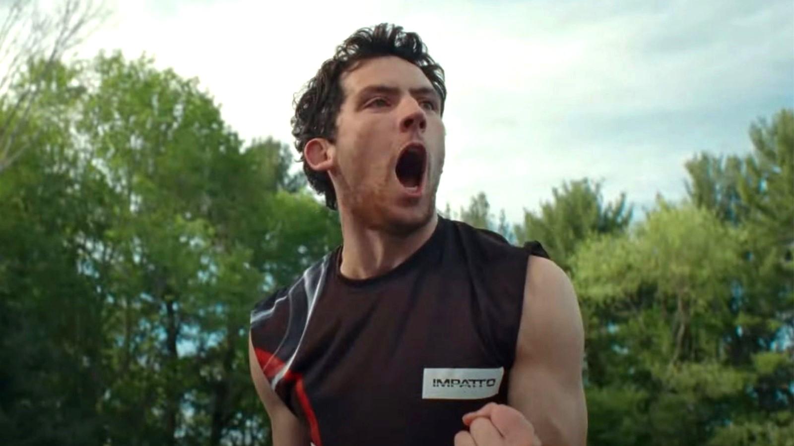 Josh O'Connor as Patrick in Challengers, yelling and holding up his fist