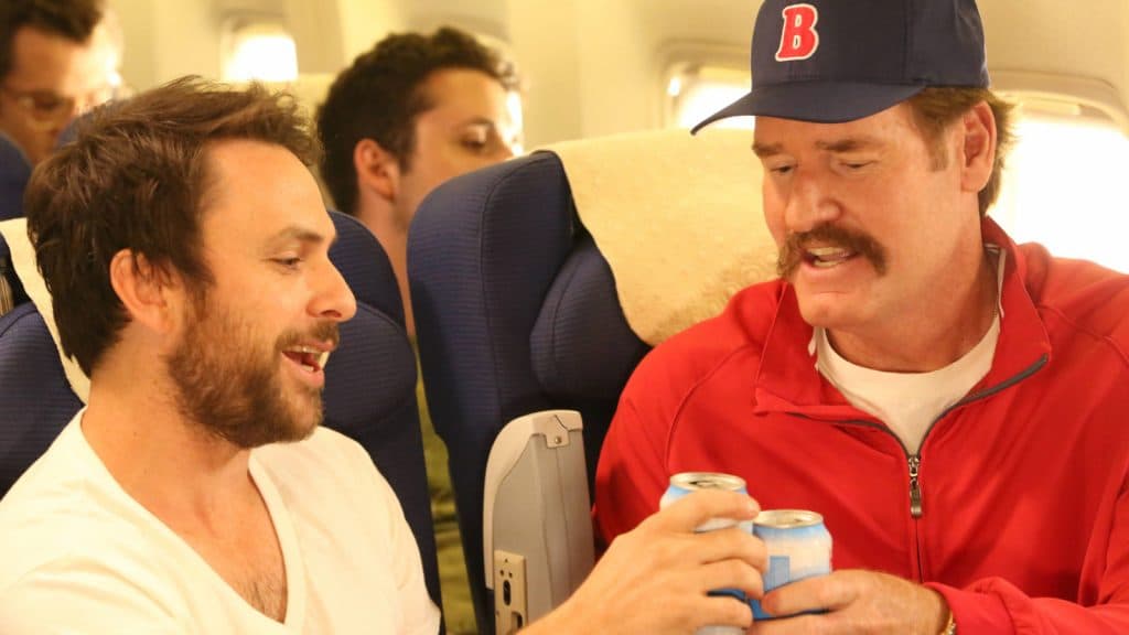 Charlie Kelly and Wade Boggs share a beer
