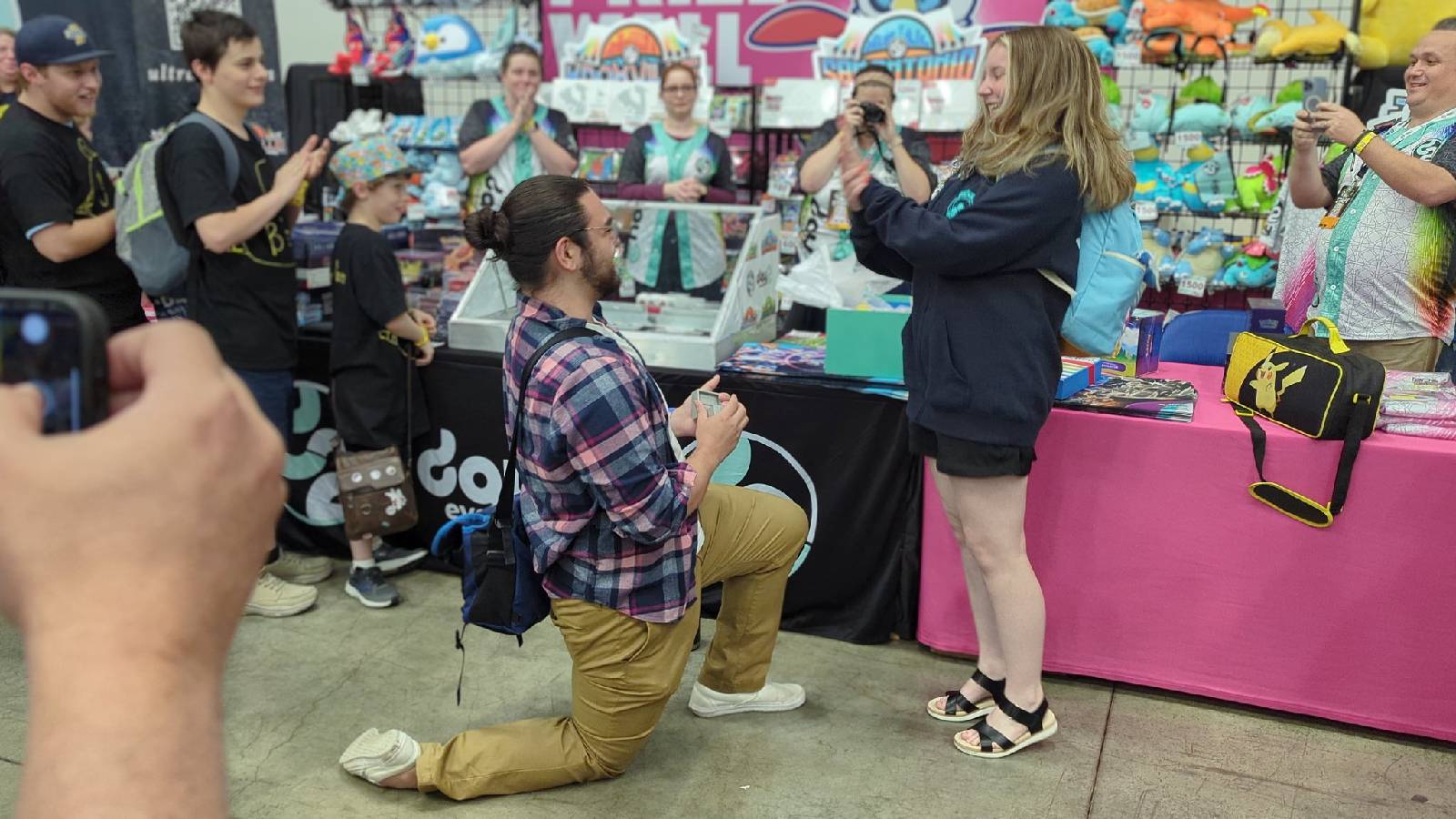 A photograph taken at Pokemon Indiana Regionals shows a man proposing to a woman