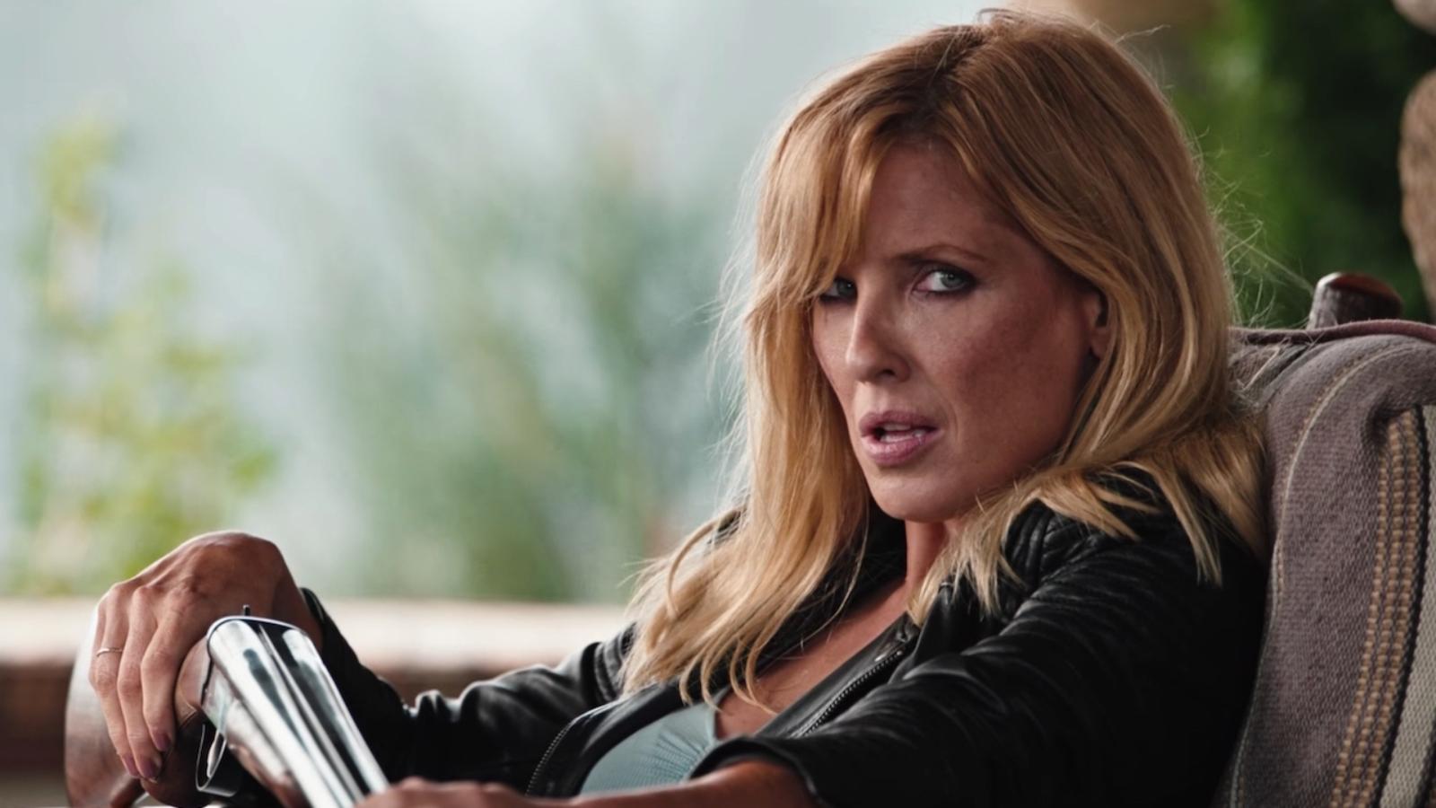 Kelly Reilly as Beth Dutton in Yellowstone, sitting in a car and leaning back