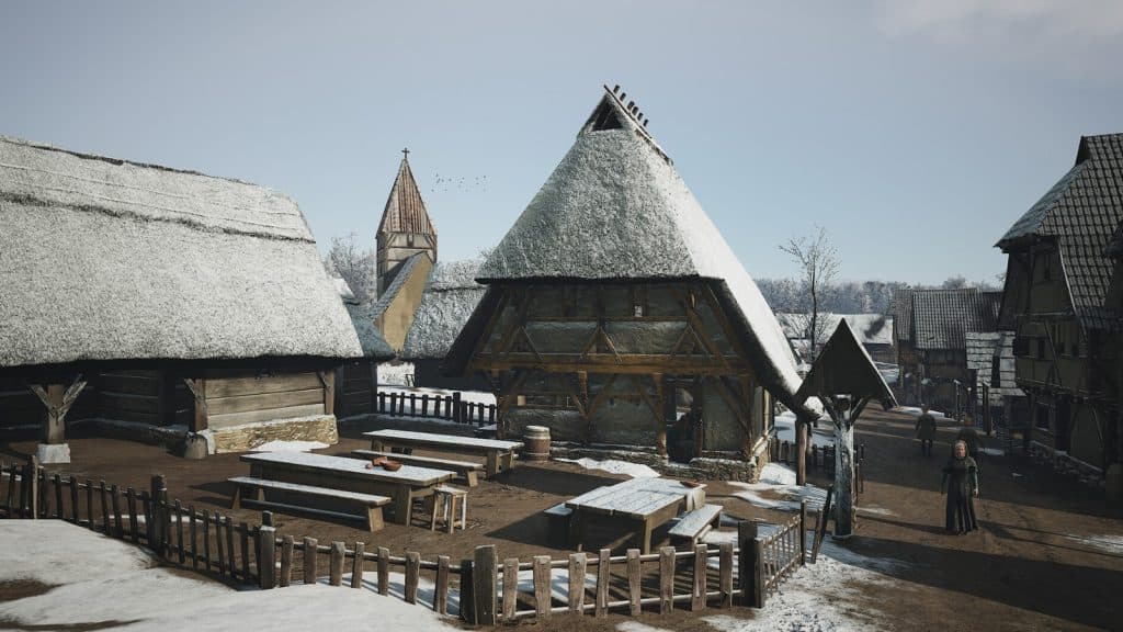 Village buildings covered in snow in Manor Lords