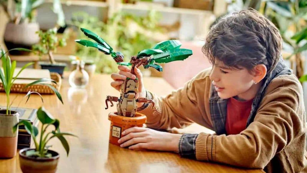 A child with their LEGO Harry Potter Mandrake
