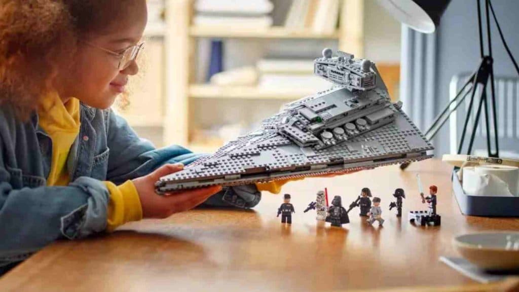 A child playing with their LEGO Star Wars Imperial Star Destroyer set