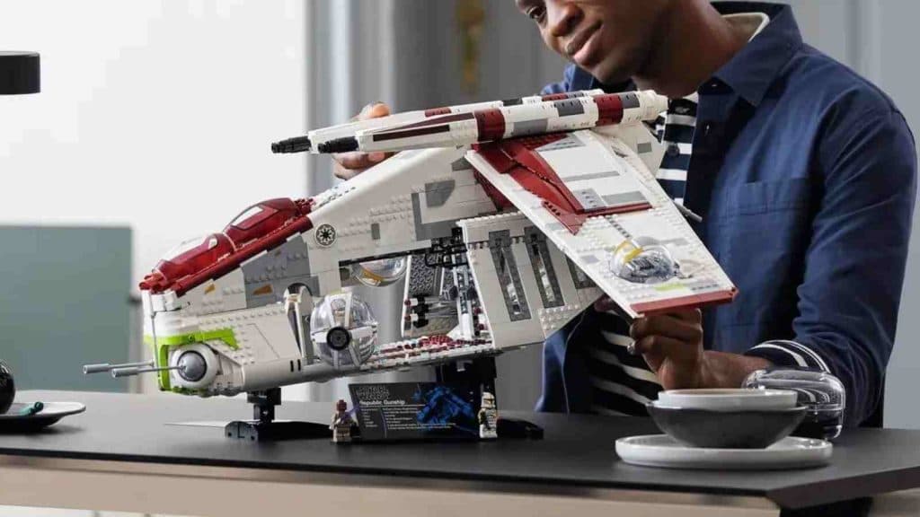 An adult with their LEGO Star Wars Republic Gunship