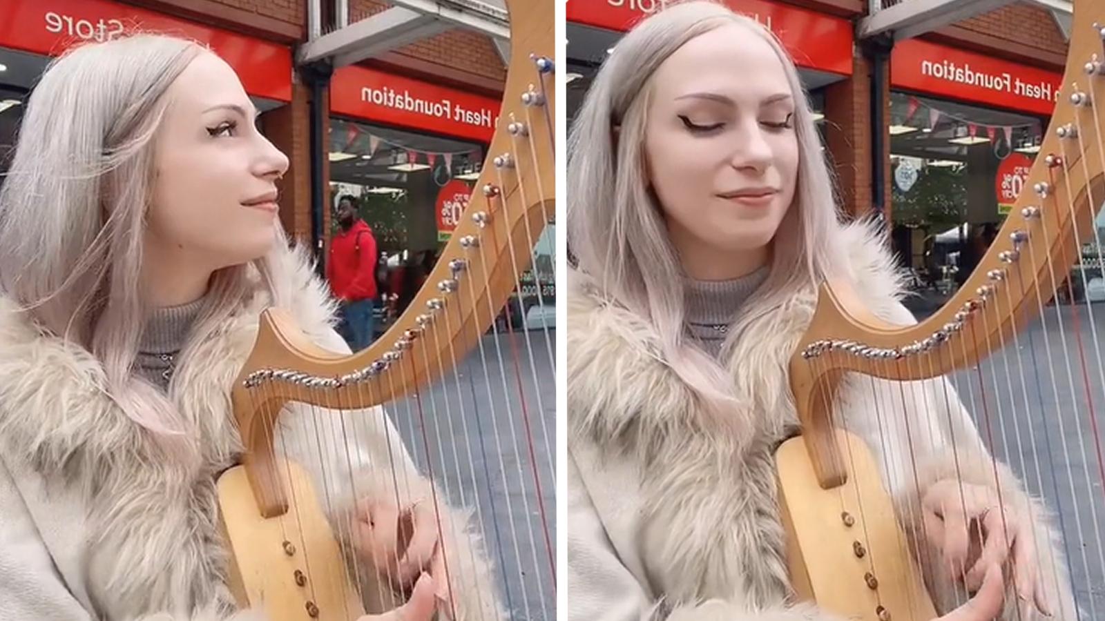 Robyn Hearts busking with her harp.