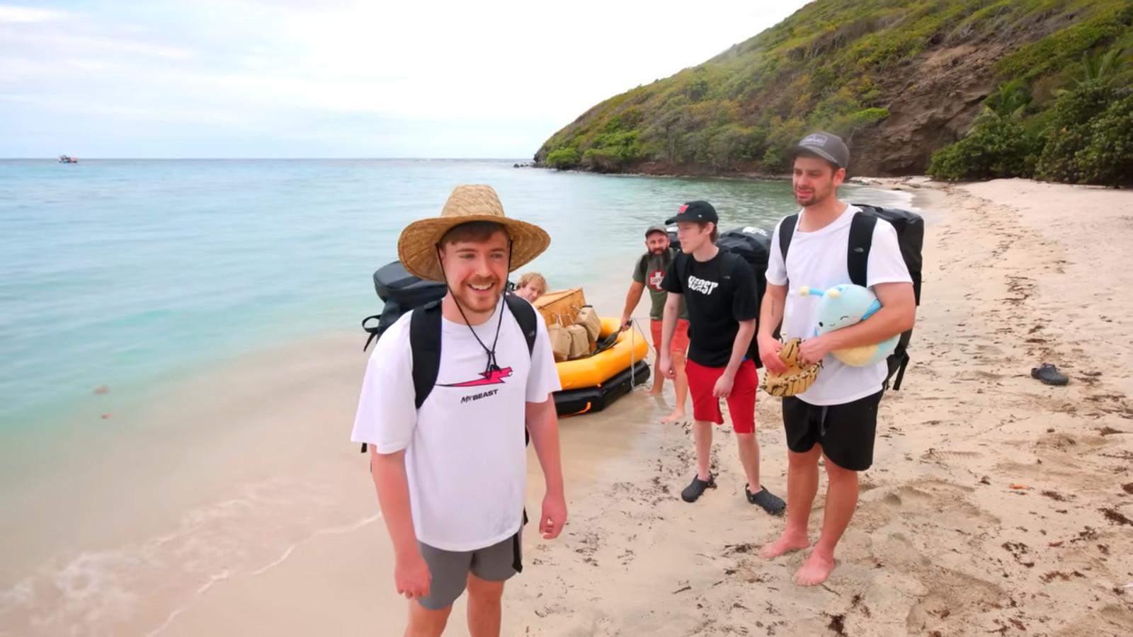 MrBeast and his crew stood on a beach